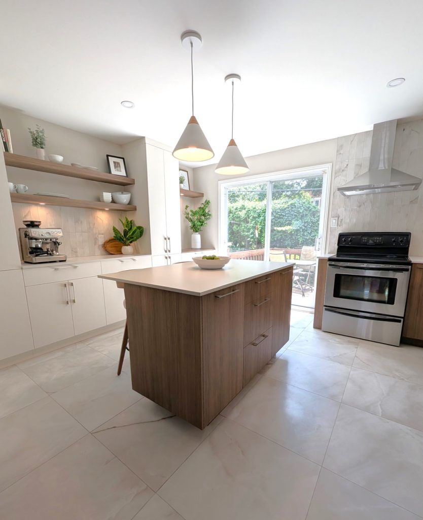 Bright luxury kitchen with soft neutral tones, warm wood island, and minimalist floating shelving — part of Lucie Pitt’s Rosemont Serenity project.